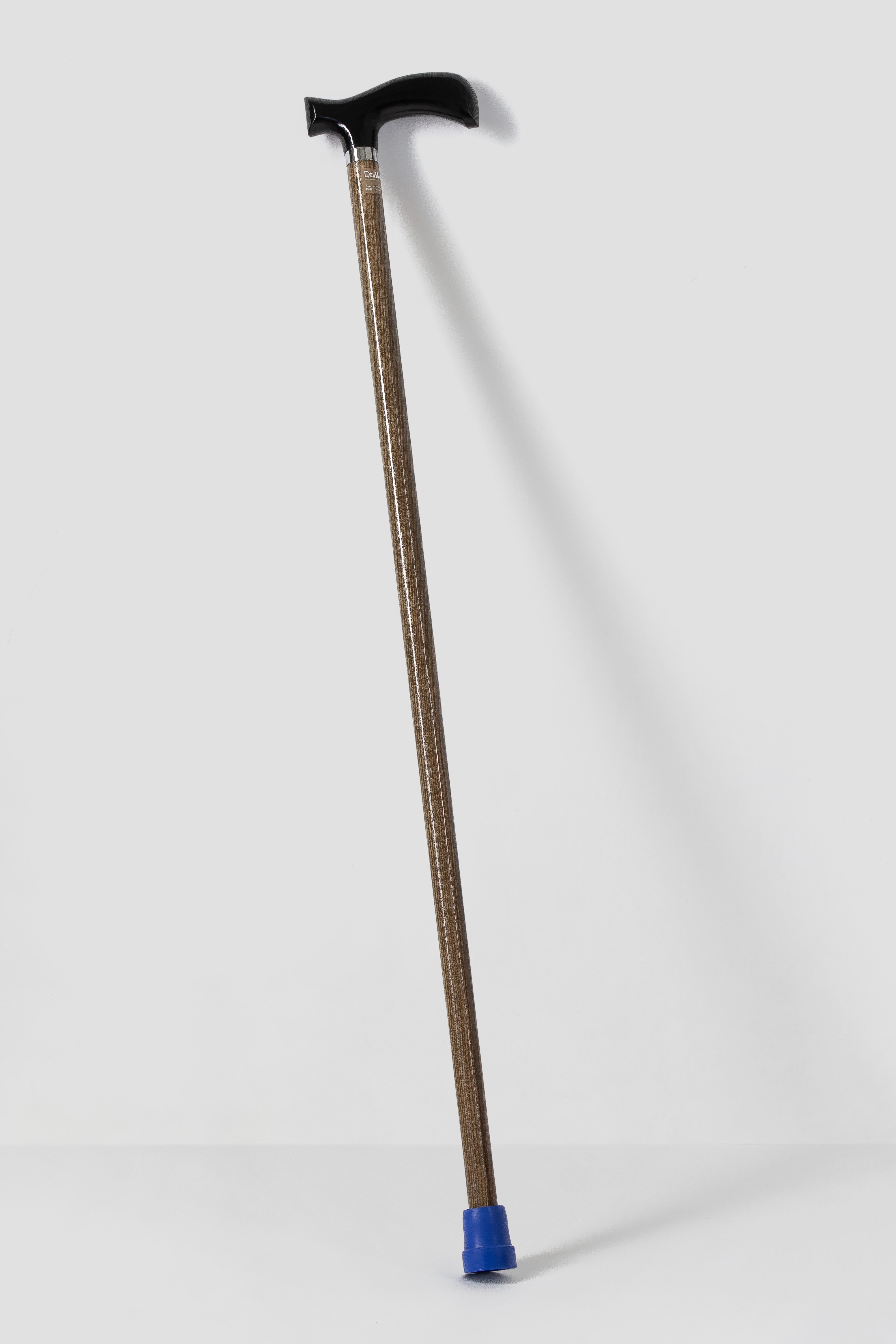 Classic black ergonomic walking cane with light natural oak. Minimalist luxury mobility aid for stable walk.