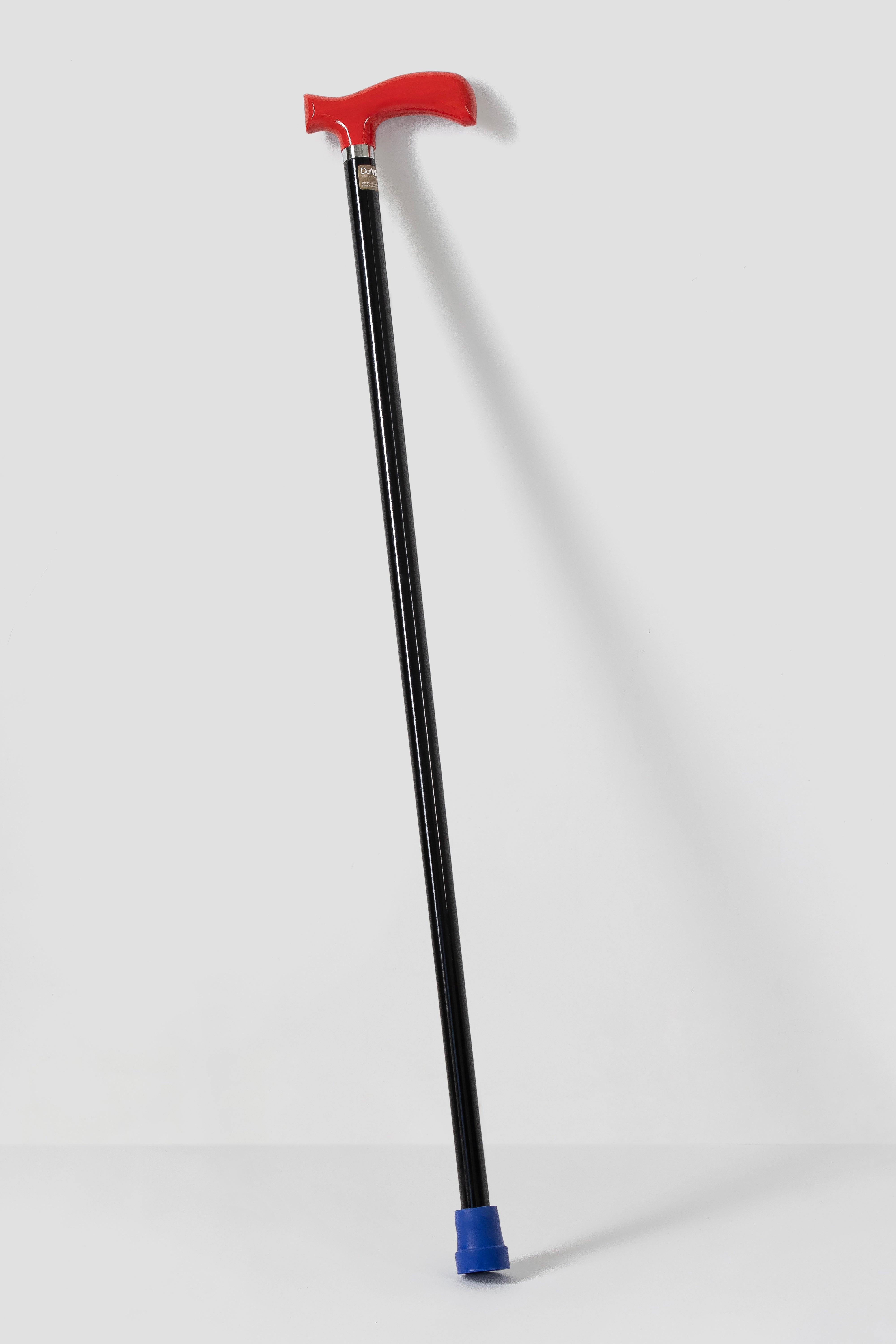 Deep red anatomical handle on minimalist black shaft. Stylish high-performance walking cane by DaiWalk.