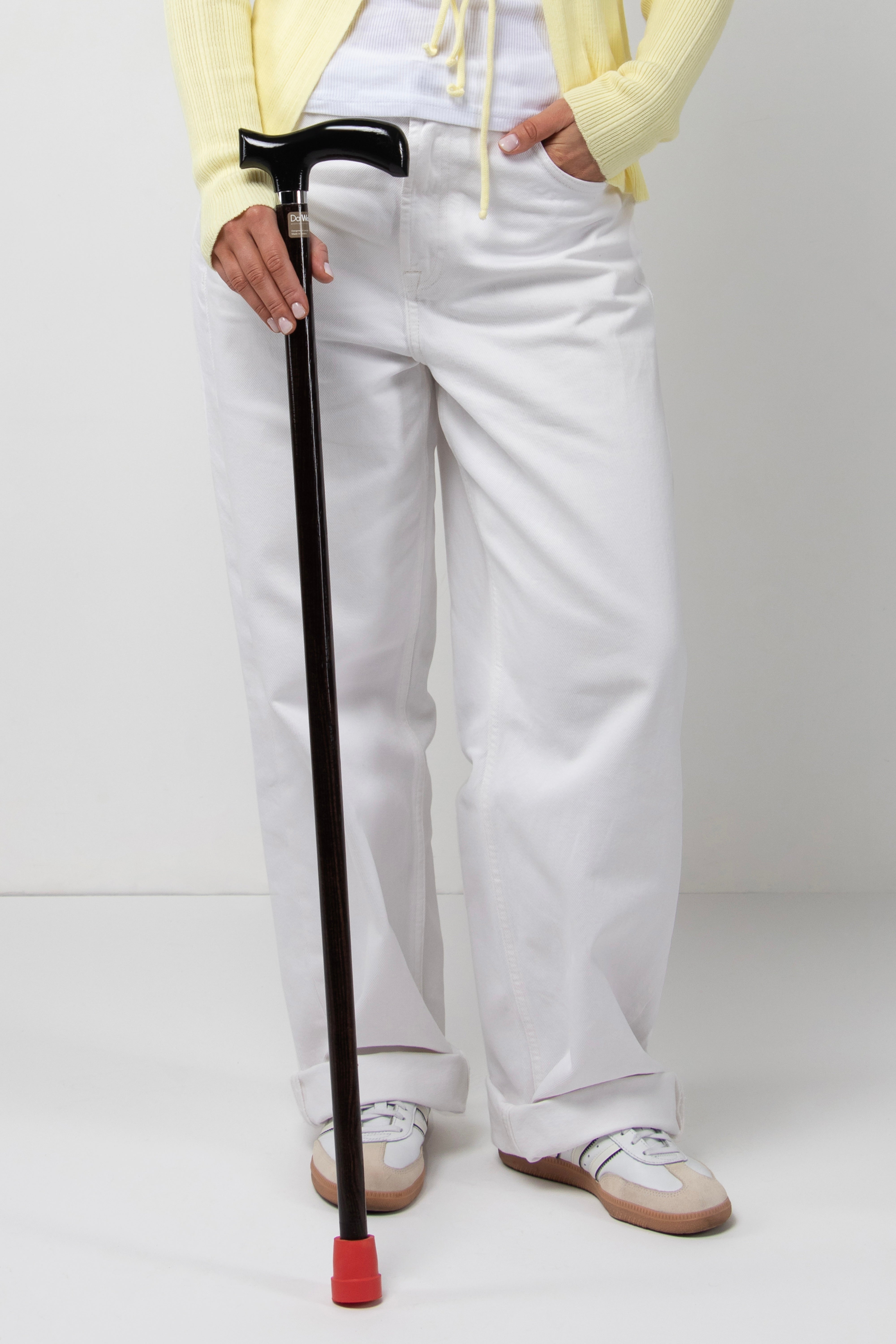Professional women's all-black anatomical walking stick with dark oak wood. Sleek design premium cane for stable and silent posture.