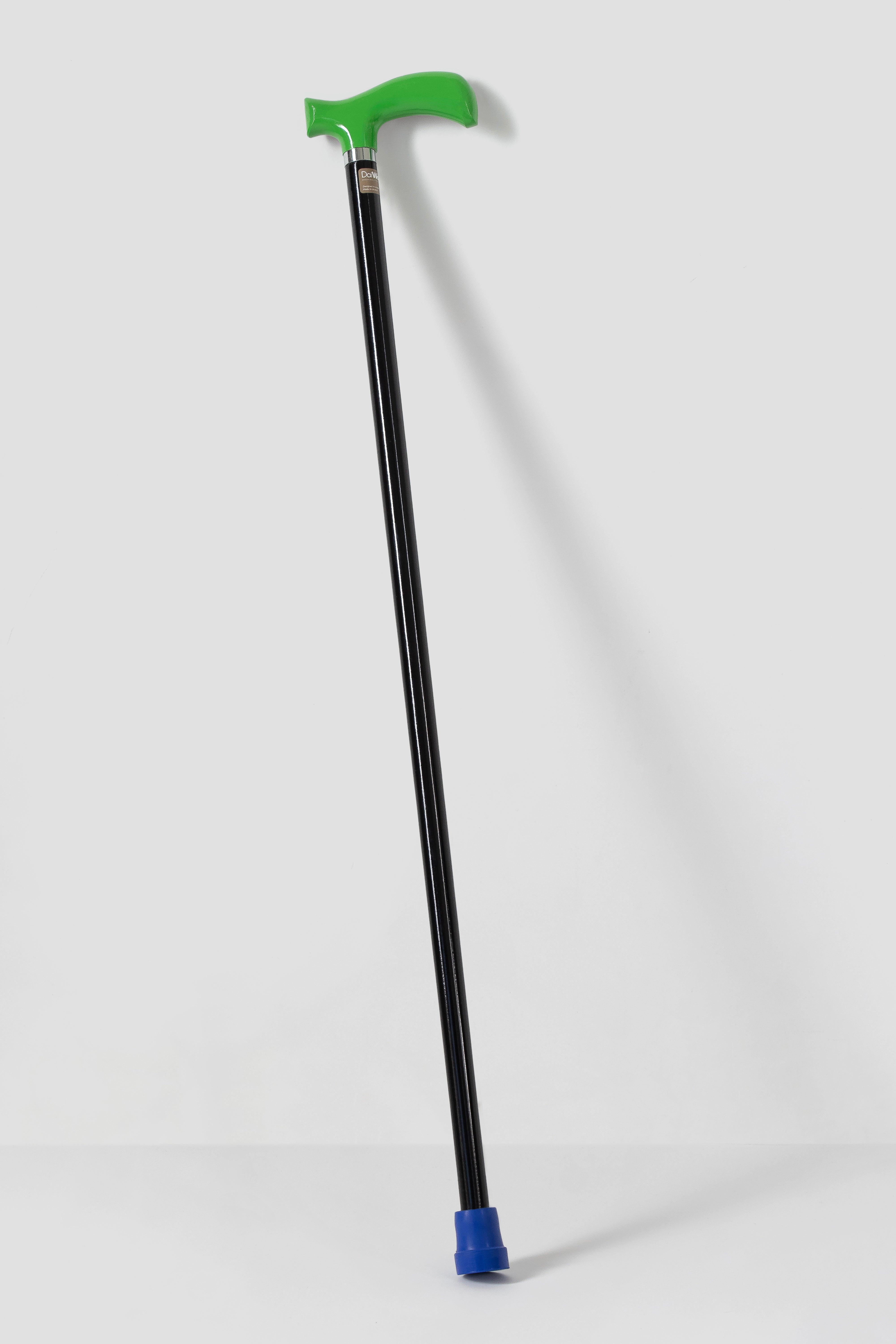 Traffic green designer cane with minimalist black shaft. High-performance lightweight mobility tool for active urban lifestyle.