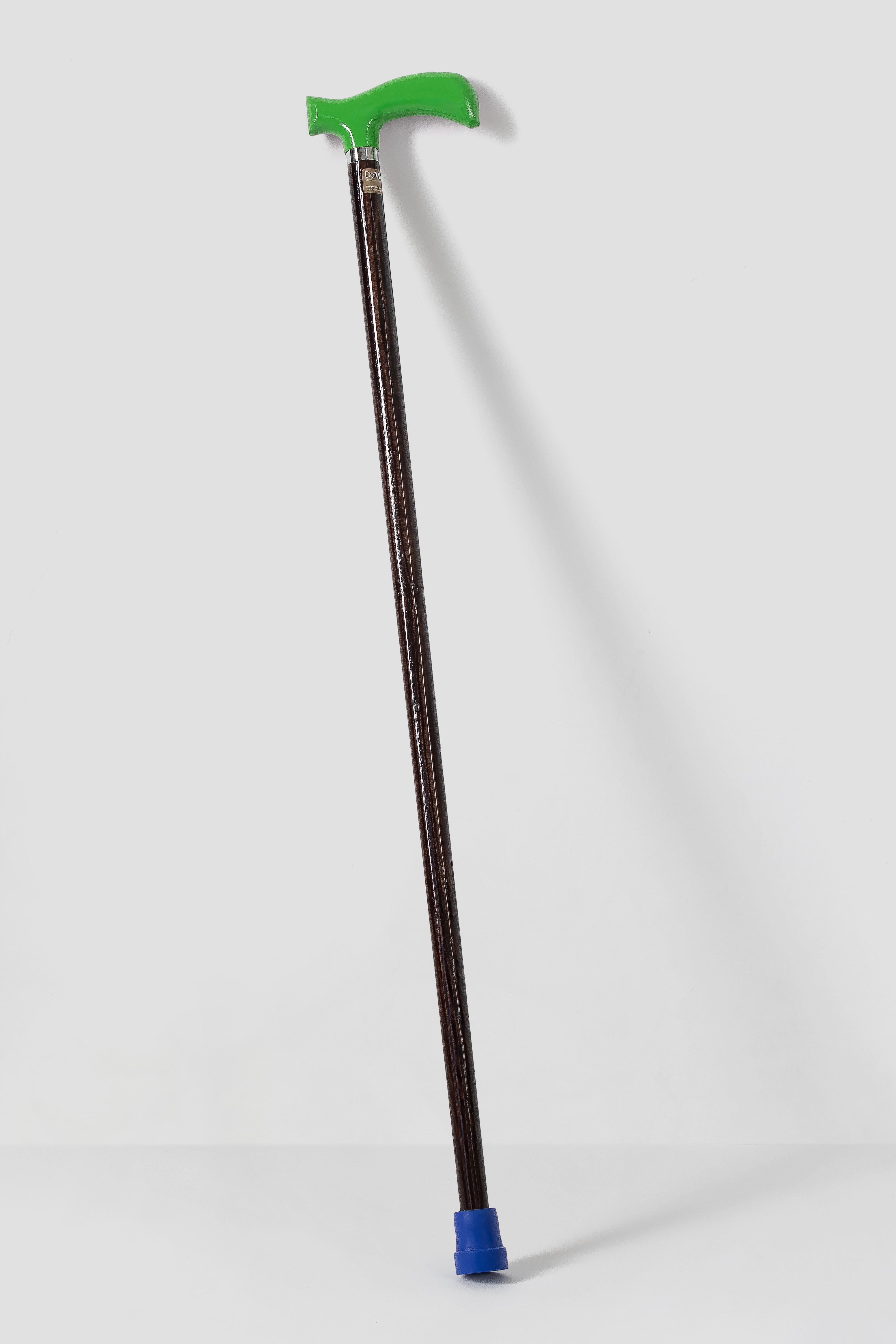 Traffic green ergonomic walking stick on dark walnut oak wood. Premium custom length cane for modern posture and style.