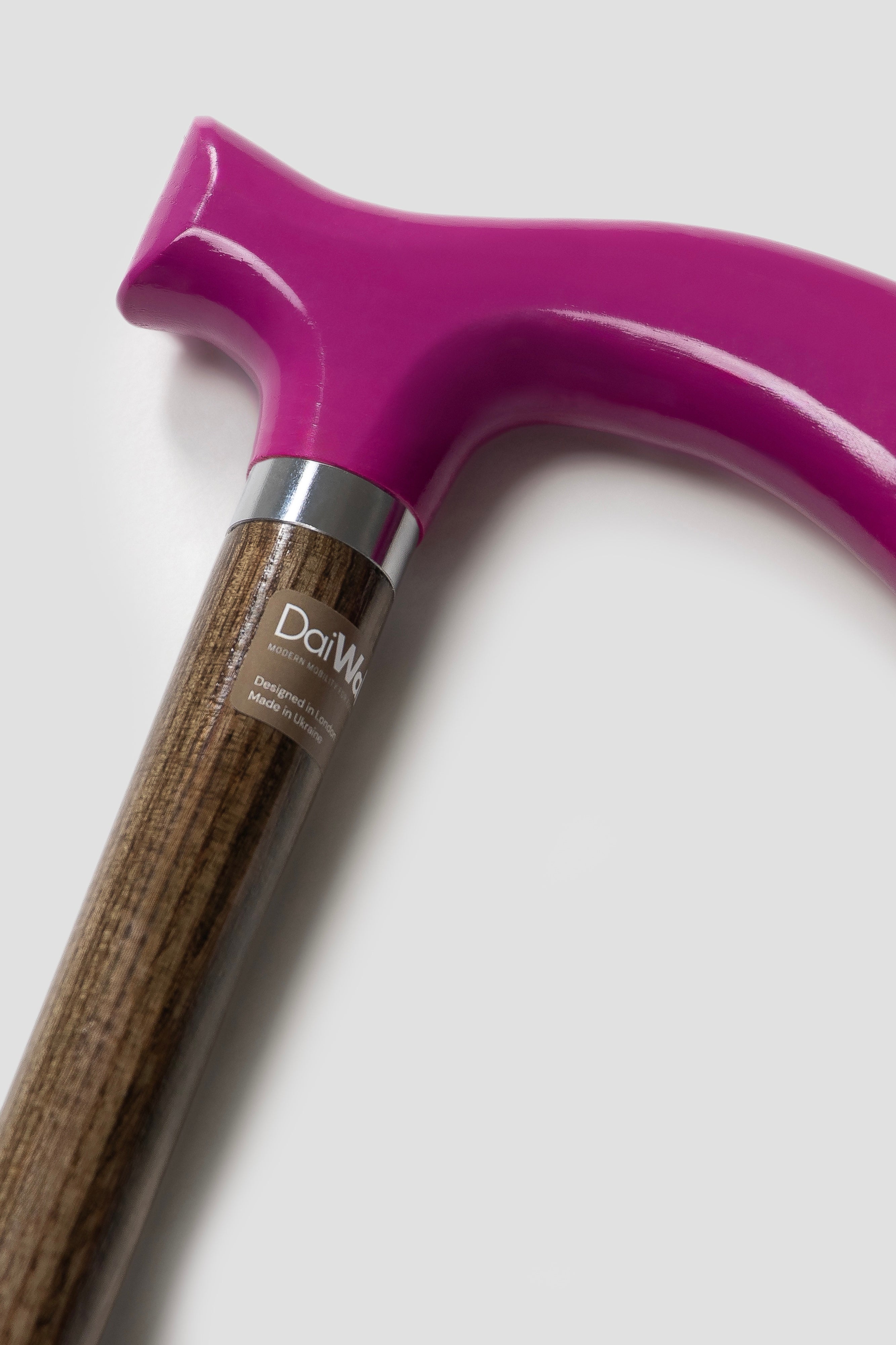Men's luxury walking cane with fuchsia pink handle and light natural oak wood shaft. Premium custom-made ergonomic mobility tool for active men.