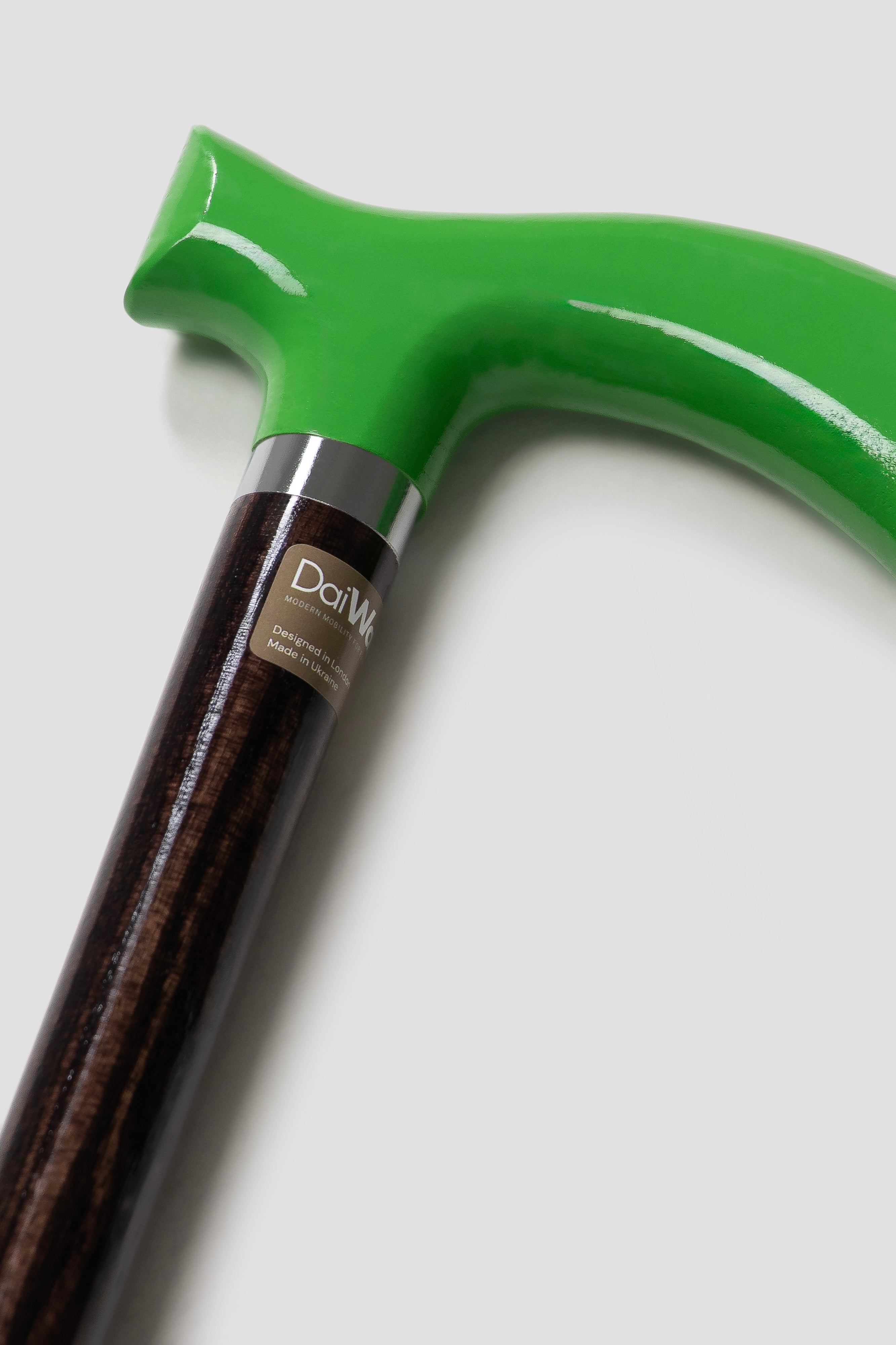 Sophisticated men’s walking stick with green handle and dark walnut oak shaft. Custom-made ergonomic support for professional men.