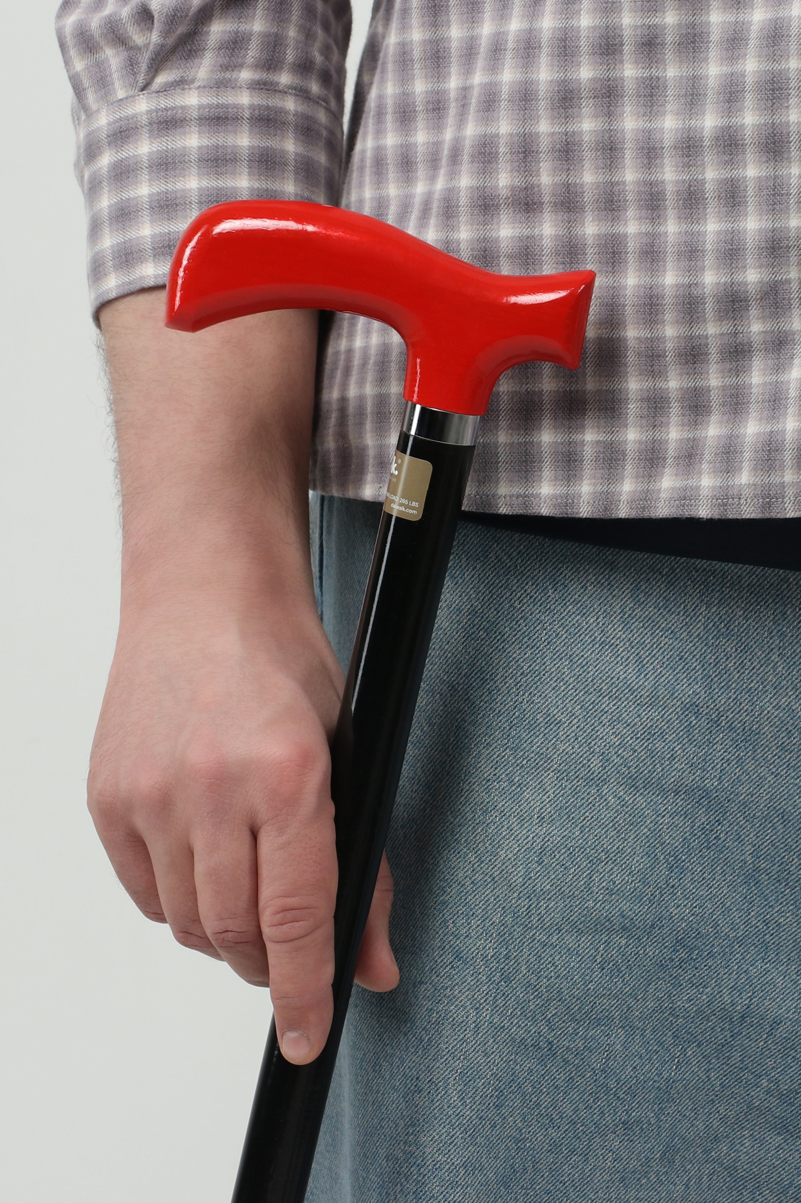 Men’s dark red handle walking cane with minimalist black shaft. Sleek high-quality ergonomic aid for modern gentlemen.