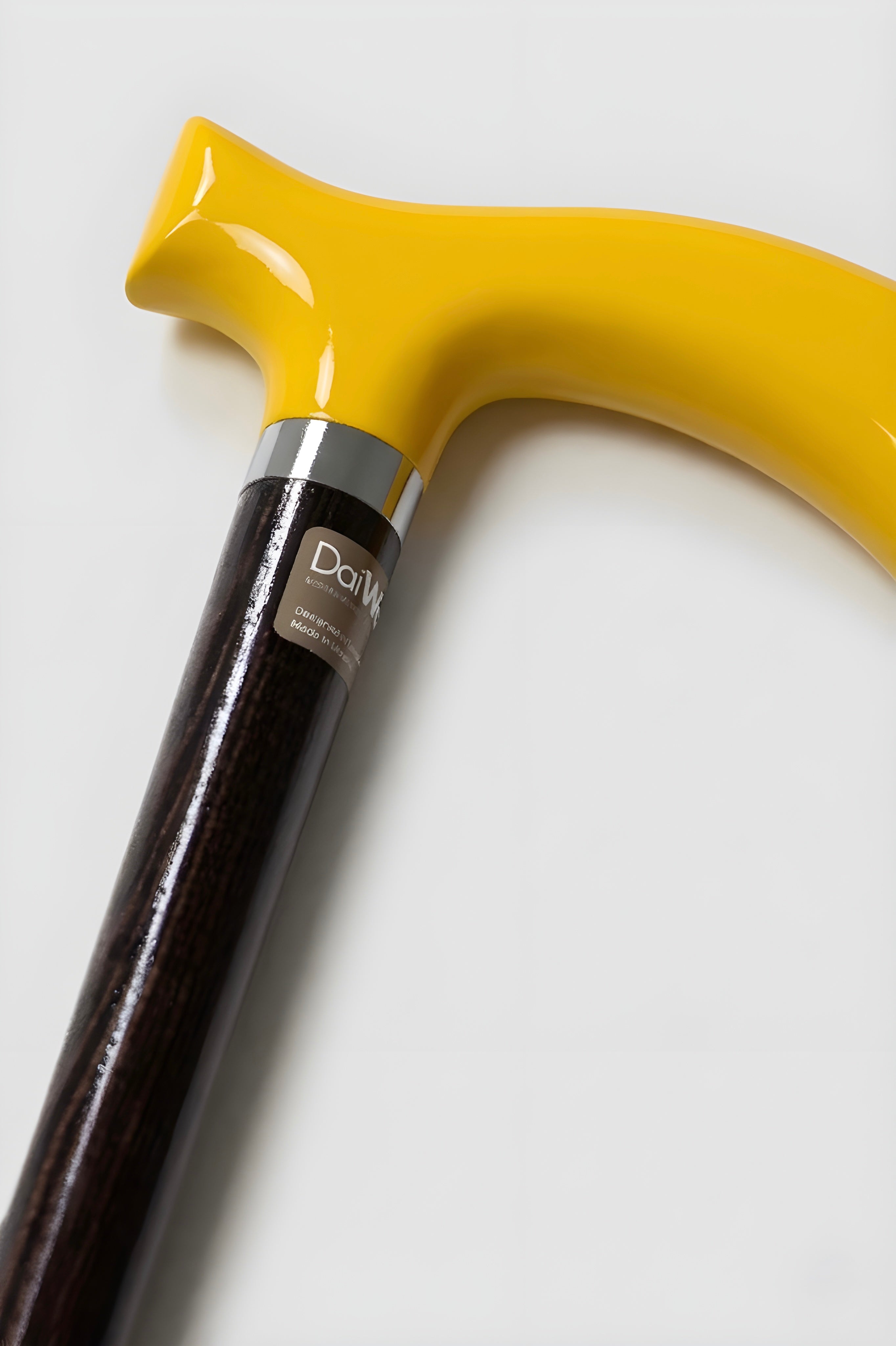 Vibrant yellow handle walking stick on dark oak wood for men. Custom made luxury cane for perfect posture and balance.