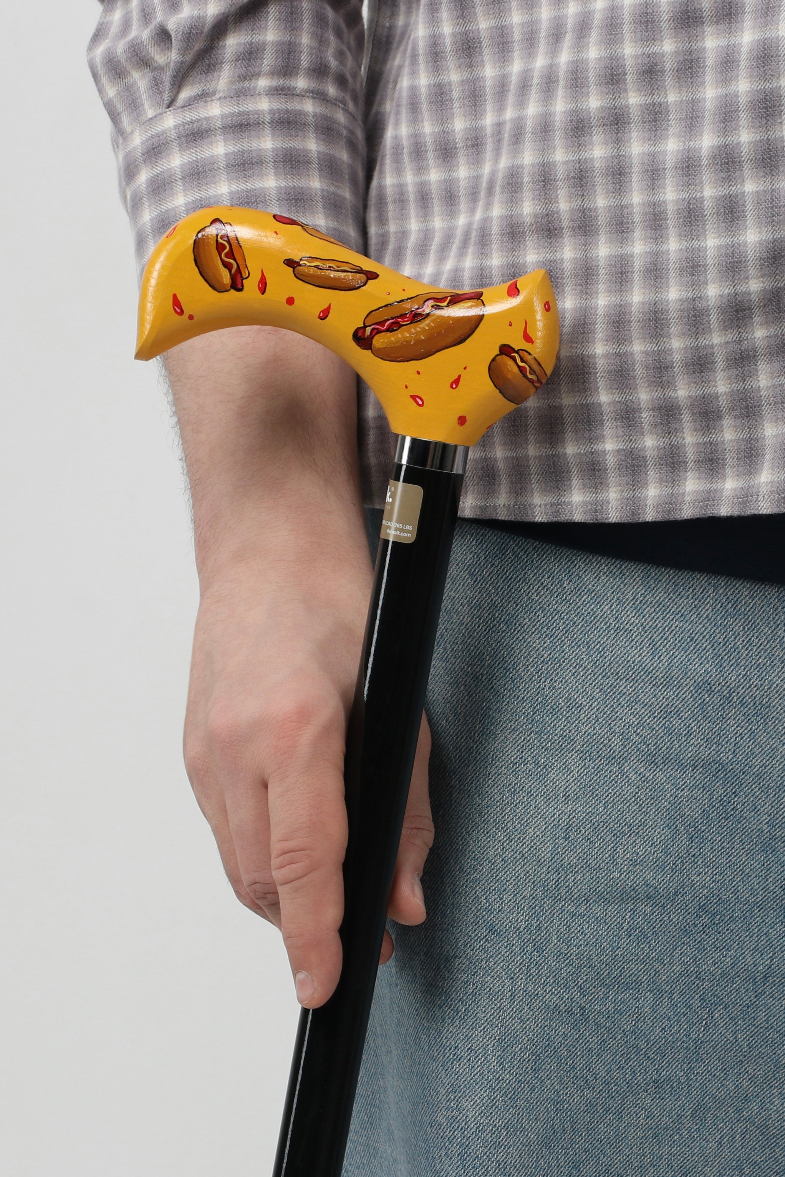 Anti-medical designer walking cane with vibrant POP series graphics. Modern alternative to hospital sticks for young men's recovery and style.