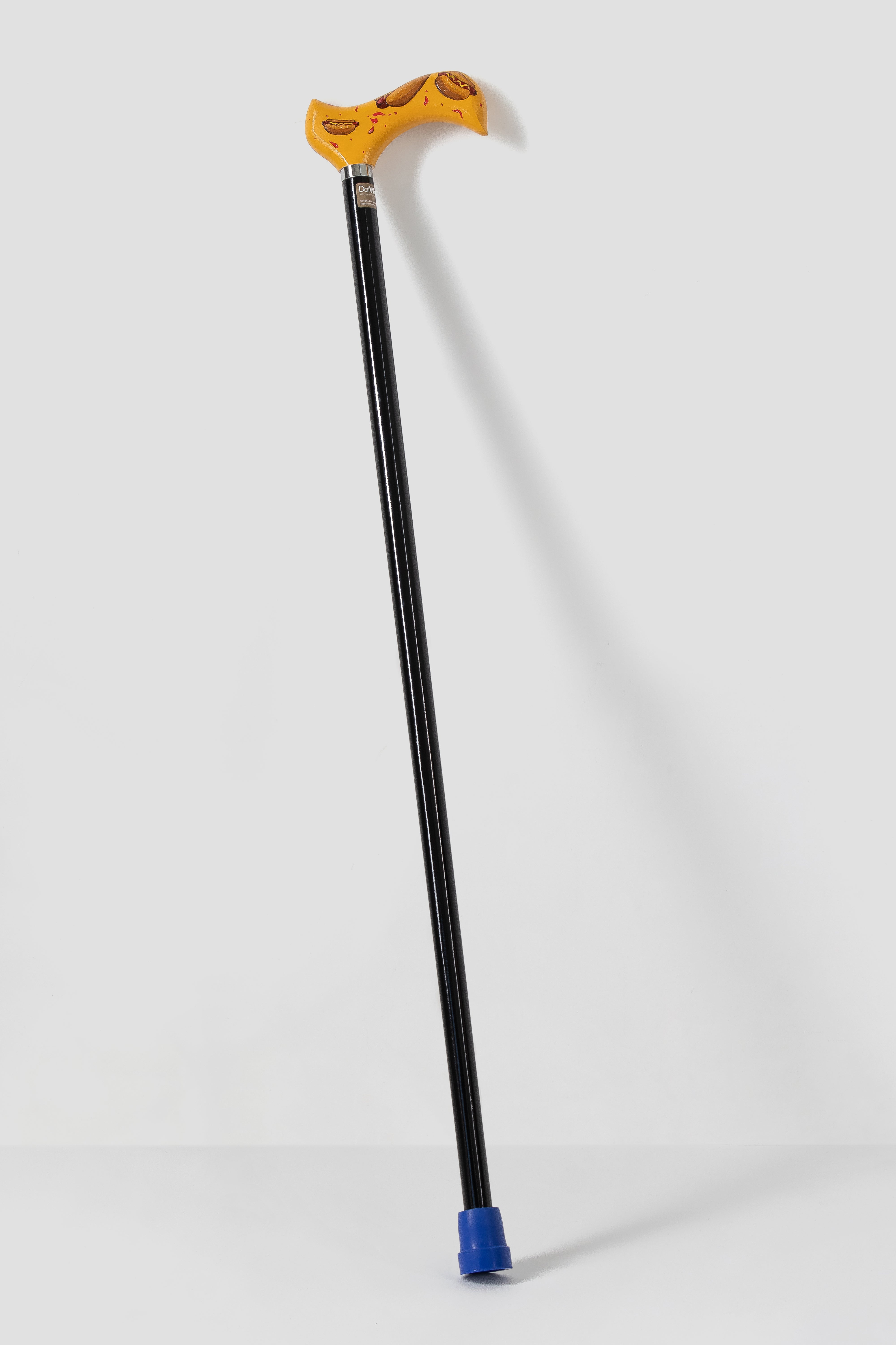Vibrant pop art pattern walking cane with anatomical grip. Artistic designer mobility aid for high-visibility and bold personality.