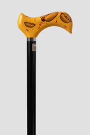 Urban streetwear walking cane from POP collection. Bold graphic patterns on ergonomic handle with matte black shaft for modern men’s fashion.